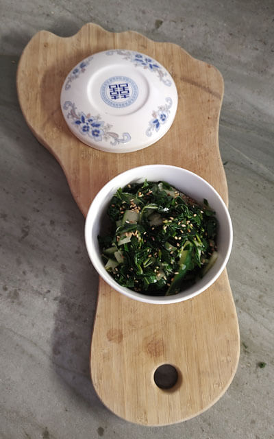 Chayakame Salad displayed on the Taking STEPs cutting board